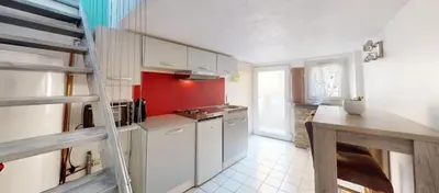 Cuisine ou kitchenette dans l'établissement Charmant duplex aux portes de Belfort
