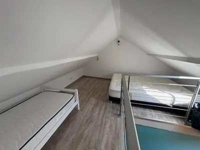 Un ou plusieurs lits dans un hébergement de l'établissement Charmant duplex aux portes de Belfort