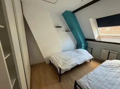 Un ou plusieurs lits dans un hébergement de l'établissement Magnifique appartement lumineux au cœur de Belfort