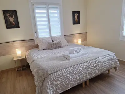 Un ou plusieurs lits dans un hébergement de l'établissement Maison Dom&Sy - Détente & Loisirs à Bussang avec sauna et salle de jeux