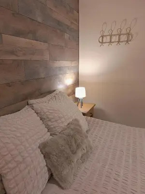 Un ou plusieurs lits dans un hébergement de l'établissement Maison Dom&Sy - Détente & Loisirs à Bussang avec sauna et salle de jeux