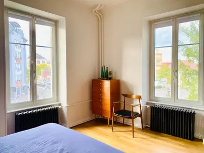 Un ou plusieurs lits dans un hébergement de l'établissement Stanislas Apartment, 8 people, private parking