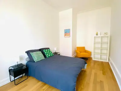 Un ou plusieurs lits dans un hébergement de l'établissement Stanislas Apartment, 8 people, private parking