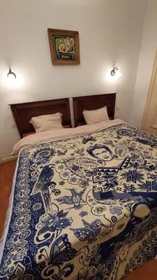 Un ou plusieurs lits dans un hébergement de l'établissement Maison Chez Grand-mère, Route des vins