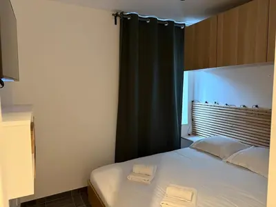 Un ou plusieurs lits dans un hébergement de l'établissement Appartement cosy en plein centre de Gérardmer