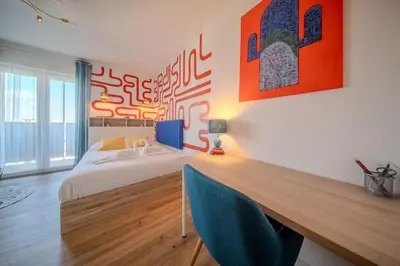 Un ou plusieurs lits dans un hébergement de l'établissement Elegance Pfastatt 2 Studio Centre Illzach
