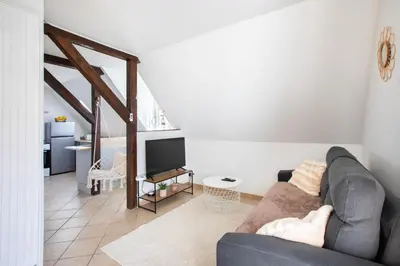 Télévision ou salle de divertissement dans l'établissement Gîte Bretzel et Grappe