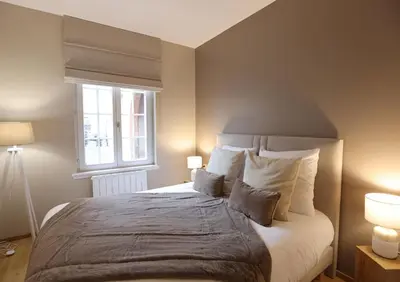 Un ou plusieurs lits dans un hébergement de l'établissement Moka - Élégant appartement 2 chambres à Colmar