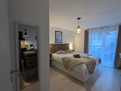 Un ou plusieurs lits dans un hébergement de l'établissement Appartement cocooning au cœur des Hautes-Vosges avec terrasse et parking privé - FR-1-589-841
