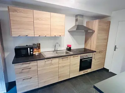 Cuisine ou kitchenette dans l'établissement Au Bord du Logelbach
