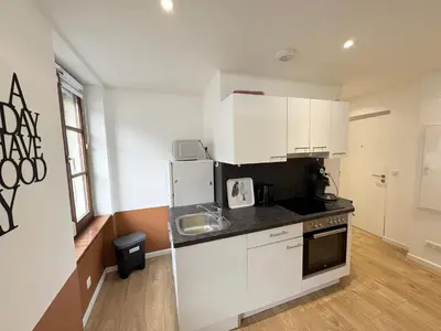 Cuisine ou kitchenette dans l'établissement Le Domaine Gabriel 3 Suites privées