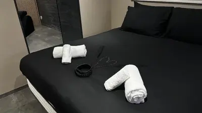 Un ou plusieurs lits dans un hébergement de l'établissement Suite intime avec sauna à Guebwiller