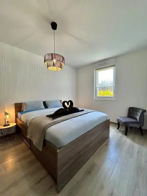 Un ou plusieurs lits dans un hébergement de l'établissement Appartement moderne - Sur le sentier des vignes