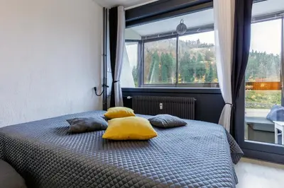 Un ou plusieurs lits dans un hébergement de l'établissement Le Cocoon de Belle Hutte sous les sapins