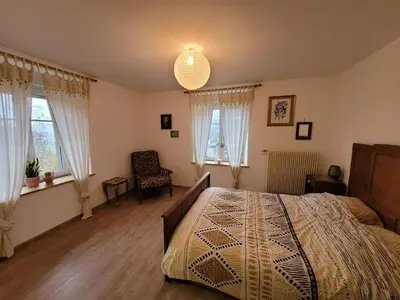 Un ou plusieurs lits dans un hébergement de l'établissement Gîte cosy dans les Vosges