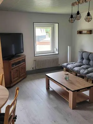 Coin salon dans l'établissement Appartement cosy rénové au calme
