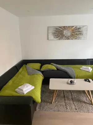 Coin salon dans l'établissement Cozy apartment near Basel Airport