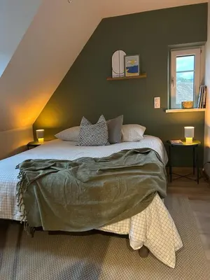 Un ou plusieurs lits dans un hébergement de l'établissement Charmant appartement avec vue sur les vignes