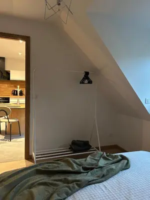 Un ou plusieurs lits dans un hébergement de l'établissement Charmant appartement avec vue sur les vignes