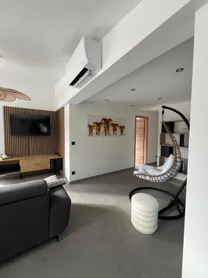 Coin salon dans l'établissement Chalet prestige avec sauna