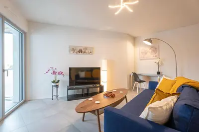 Coin salon dans l'établissement Alcazar Bel Appartement Saint-Louis Parking Prive