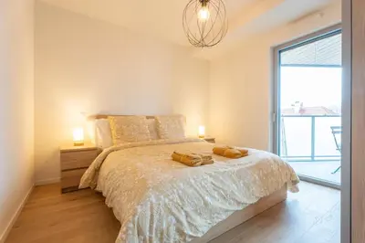 Un ou plusieurs lits dans un hébergement de l'établissement Alcazar Bel Appartement Saint-Louis Parking Prive