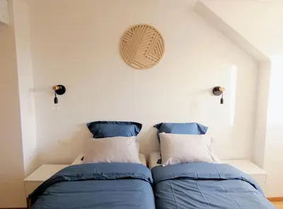 Un ou plusieurs lits dans un hébergement de l'établissement Le balcon suspendu