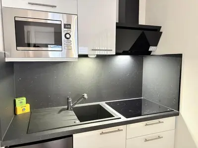 Cuisine ou kitchenette dans l'établissement Magnifique logement hyper centre Mulhouse Lambert