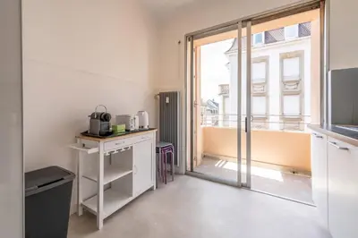 Cuisine ou kitchenette dans l'établissement Very nice apartment, center near Colmar train station