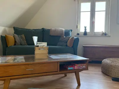 Coin salon dans l'établissement Gîte le Nid