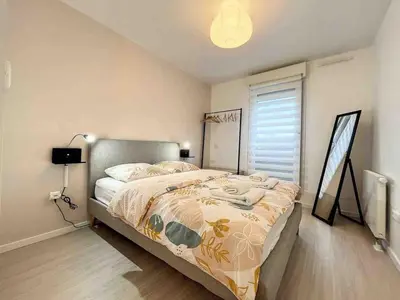 Un ou plusieurs lits dans un hébergement de l'établissement Dream Home Appartement Saint-Louis Proche Bale