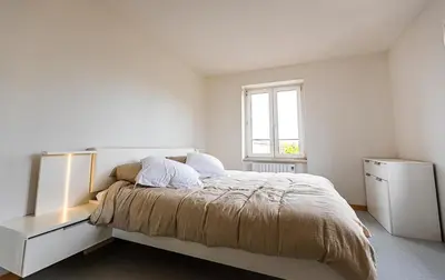 Un ou plusieurs lits dans un hébergement de l'établissement Super appartement Near Basel