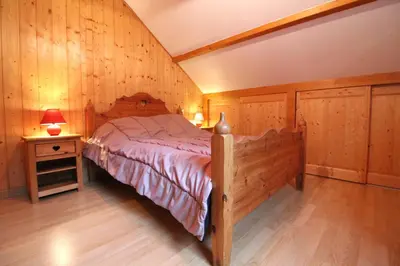 Un ou plusieurs lits dans un hébergement de l'établissement Le Chalet Vert entre nature et animations