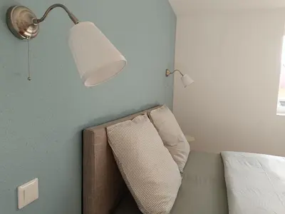Un ou plusieurs lits dans un hébergement de l'établissement Chez Marguerite & Alphonse 2 pièces proche Colmar