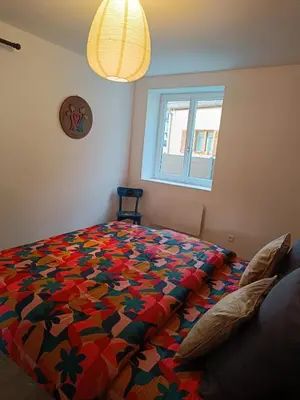Un ou plusieurs lits dans un hébergement de l'établissement Le Petit Baz'Art 2 pièces proche Colmar