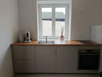 Cuisine ou kitchenette dans l'établissement Le Petit Baz'Art 2 pièces proche Colmar