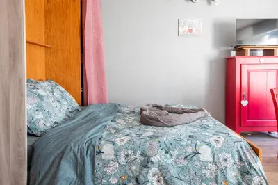 Un ou plusieurs lits dans un hébergement de l'établissement Studio familial de charme 3 Epis Belvédère