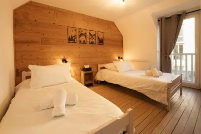 Un ou plusieurs lits dans un hébergement de l'établissement Maison cosy rénovée, cœur de Gérardmer proche lac