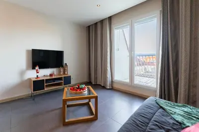 Télévision ou salle de divertissement dans l'établissement Le 12 - City Center