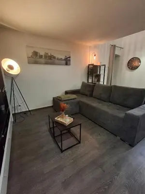 Coin salon dans l'établissement Appartement Floriloft