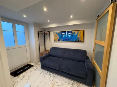 Coin salon dans l'établissement Studio neuf élégant Proche gare Mulhouse