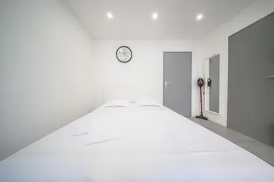 Un ou plusieurs lits dans un hébergement de l'établissement appartement à proximité de bâle avec accès tram et wifi