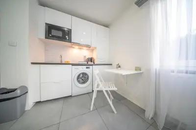 Cuisine ou kitchenette dans l'établissement appartement à proximité de bâle avec accès tram et wifi