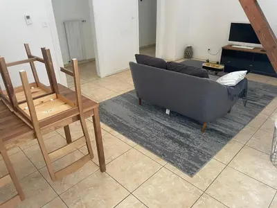 Coin salon dans l'établissement Appartement spacieux, proche centre ville
