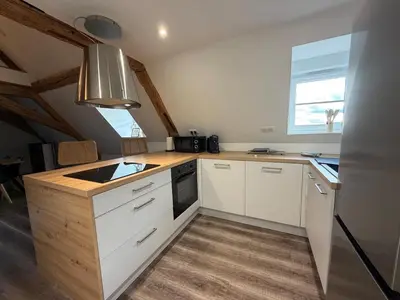 Cuisine ou kitchenette dans l'établissement La cotonnade - Entre vignes et ville