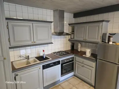 Cuisine ou kitchenette dans l'établissement Gîtes du Moulin
