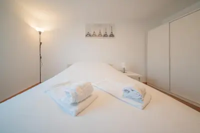 Un ou plusieurs lits dans un hébergement de l'établissement Beautiful apartment Near Basel 4 people Huningue