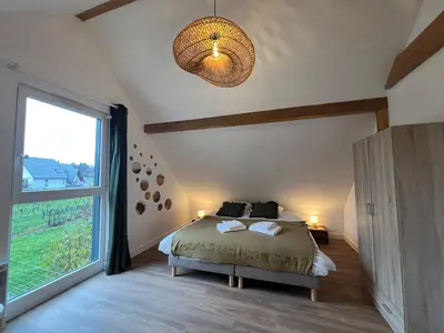 Un ou plusieurs lits dans un hébergement de l'établissement Maison des 5 cépages - chez vigneron - jardin terrasse et parking