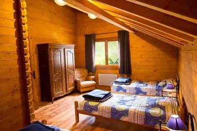 Un ou plusieurs lits dans un hébergement de l'établissement Chalet spacieux à Le Tholy avec vue montagne