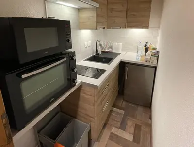 Cuisine ou kitchenette dans l'établissement Charming Apartment au pied des pistes